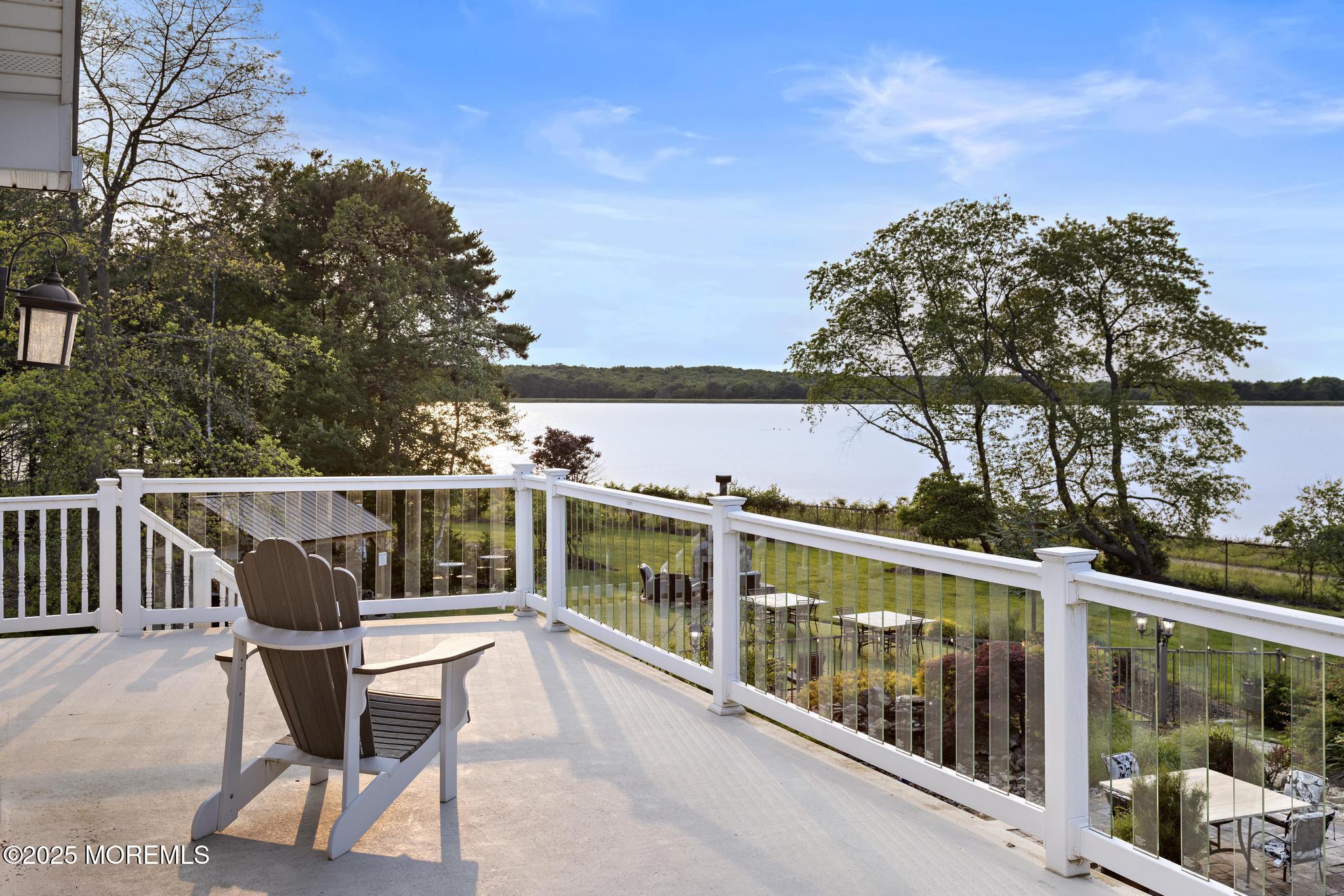 1413 Gully Road Wall, NJ 07719 - Photo 42 of 82 a view of a balcony with wooden chairs and floor and fence