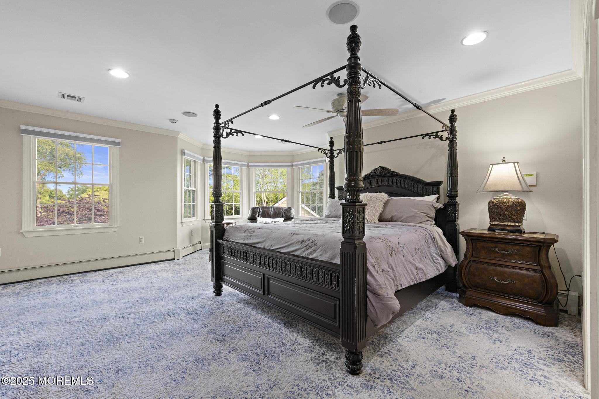 1413 Gully Road Wall, NJ 07719 - Photo 45 of 82 a bedroom with a bed a lamp and a window