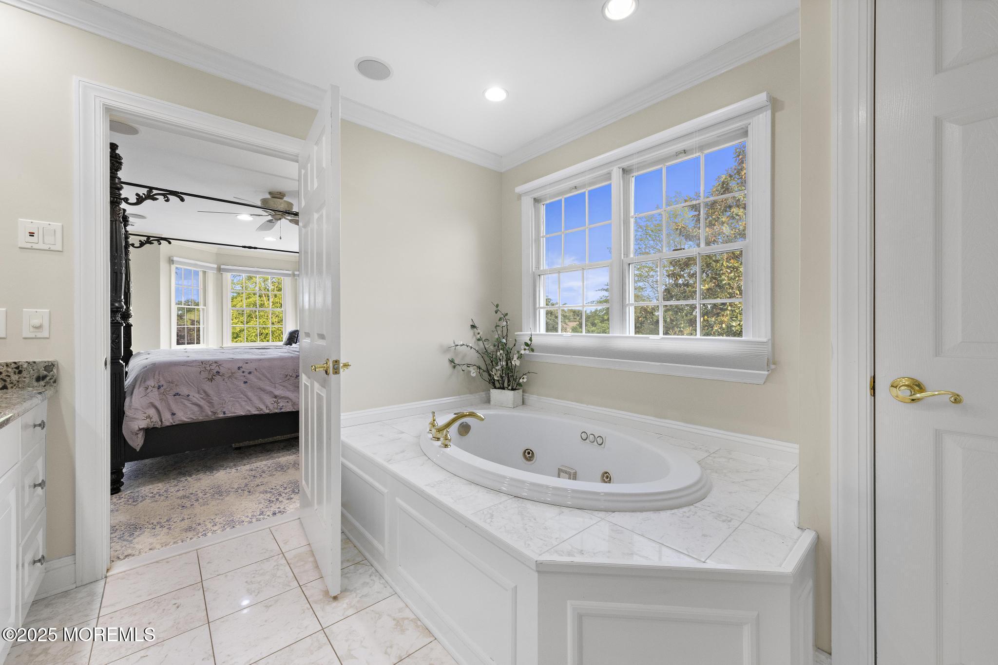 1413 Gully Road Wall, NJ 07719 - Photo 46 of 82 a en suite spacious bathroom with a tub sink and glass door