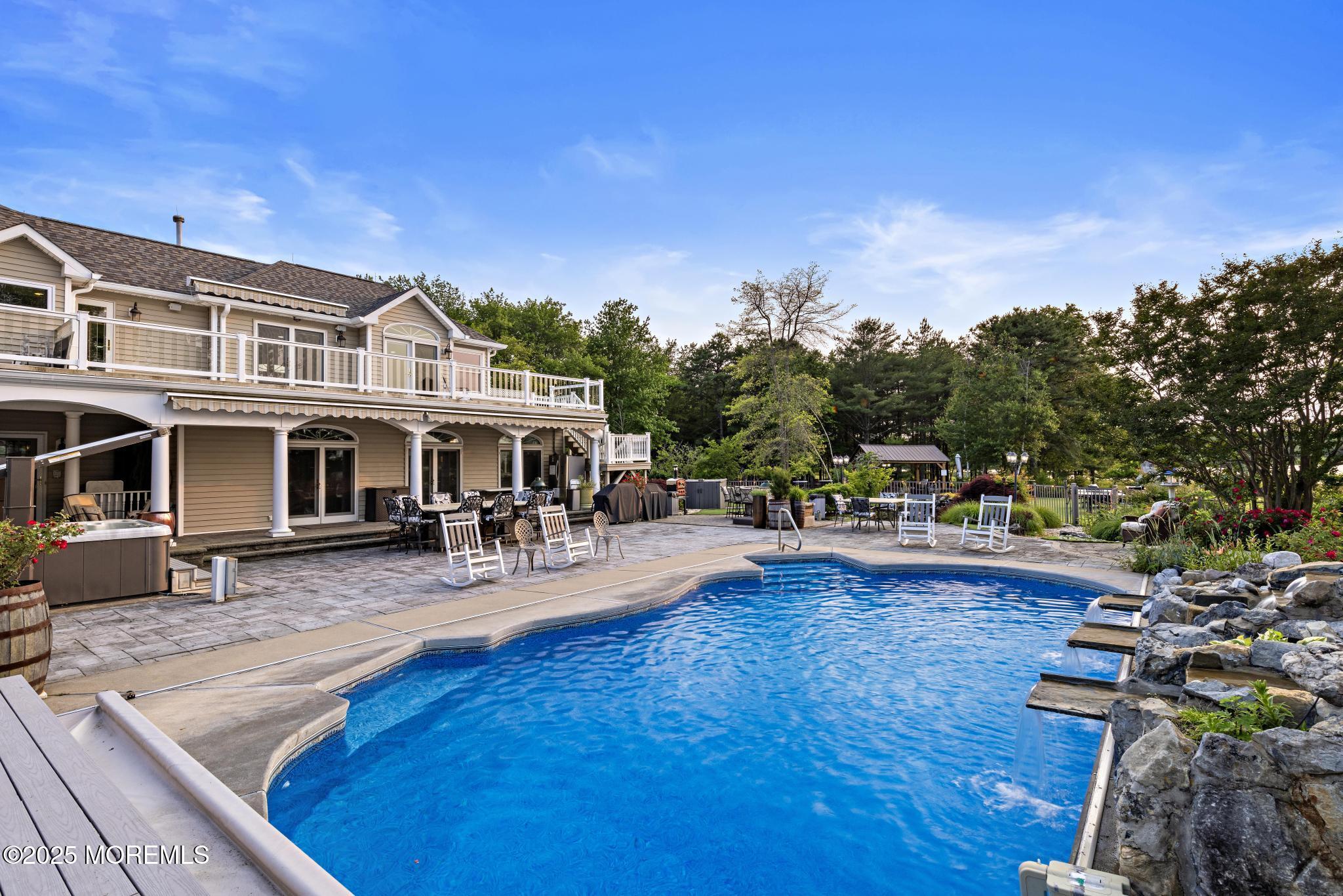 1413 Gully Road Wall, NJ 07719 - Photo 56 of 82 a view of a house with swimming pool and sitting area
