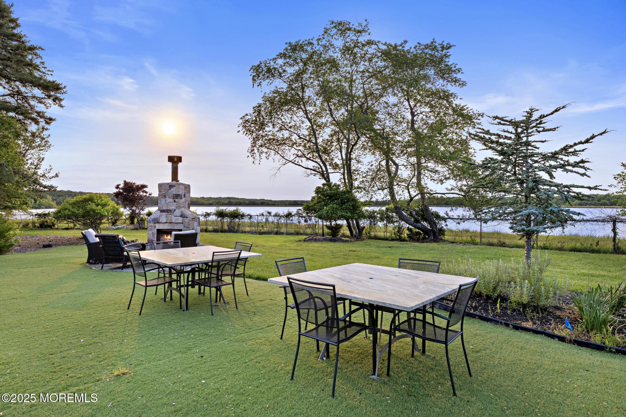 1413 Gully Road Wall, NJ 07719 - Photo 65 of 82 a table and chairs sitting in the middle of a park