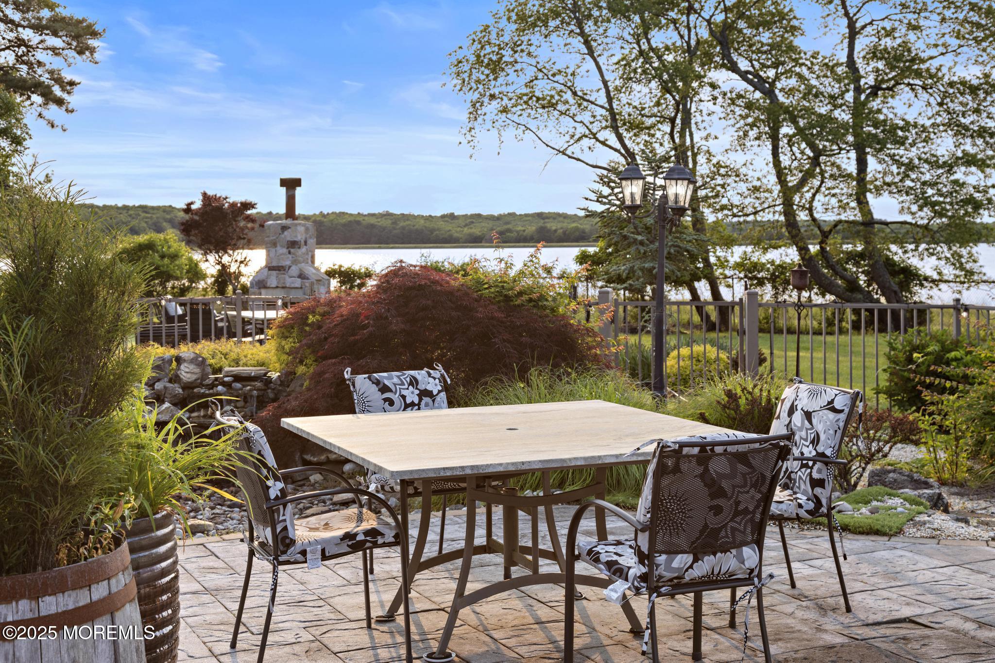1413 Gully Road Wall, NJ 07719 - Photo 68 of 82 a view of an outside dining space with furniture and lake view