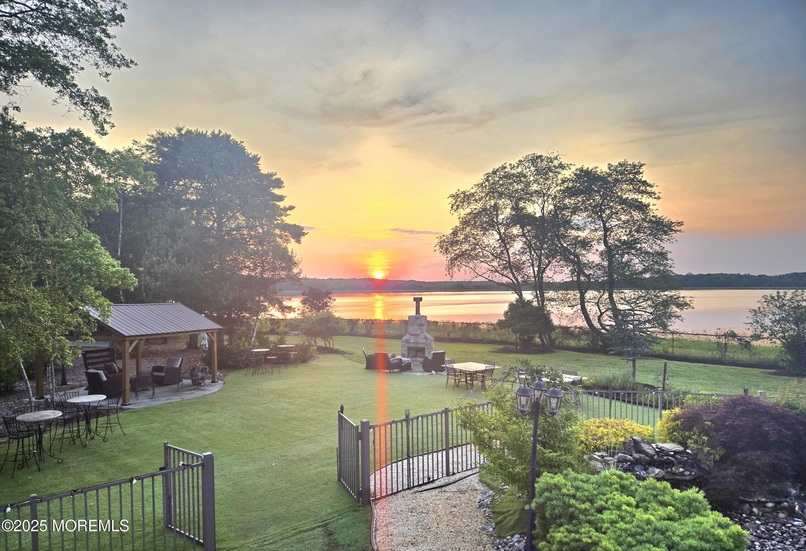 1413 Gully Road Wall, NJ 07719 - Photo 8 of 82 a view of a lake with a building in the background