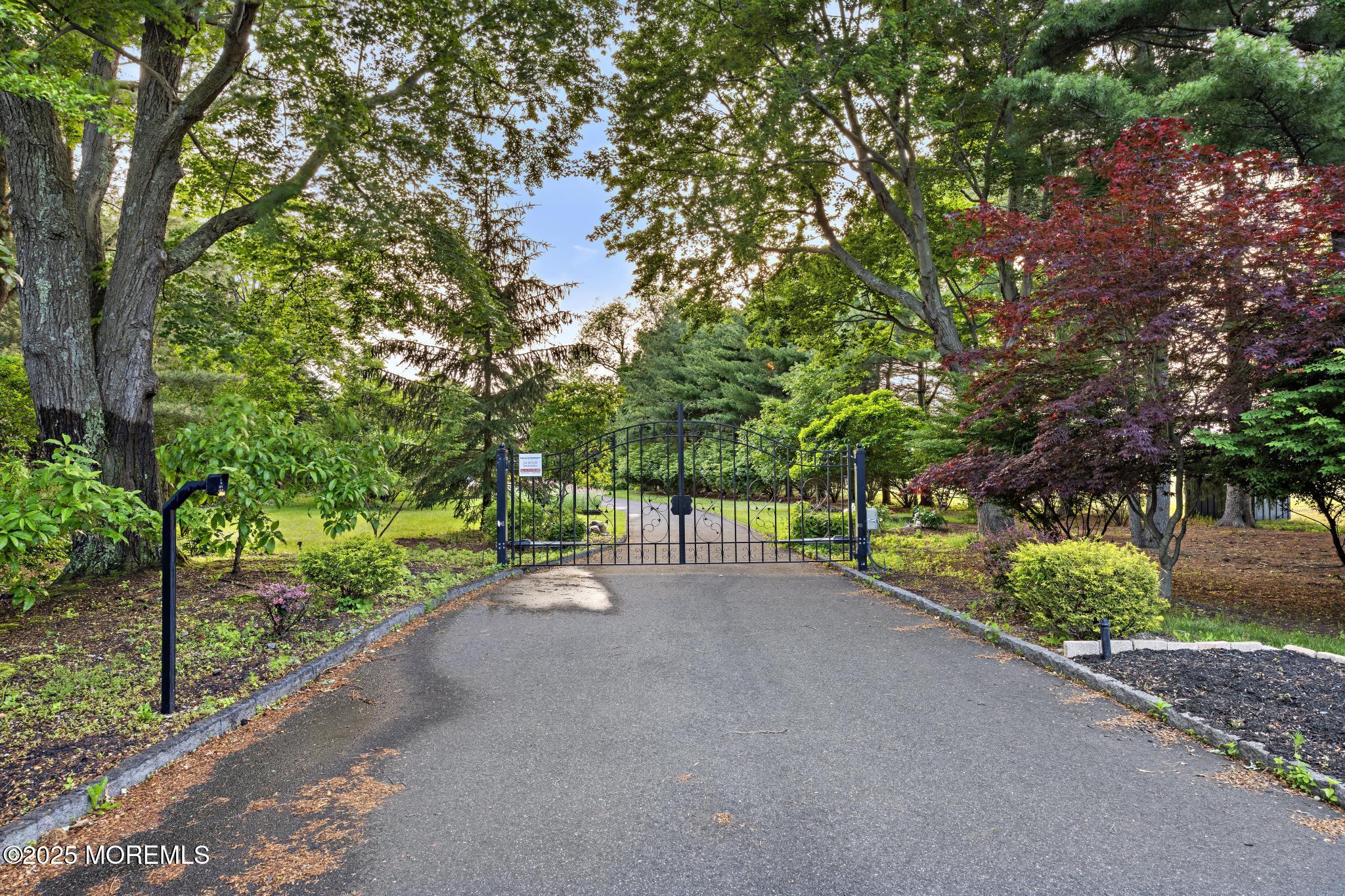 1413 Gully Road Wall, NJ 07719 - Photo 9 of 82 a view of a street with a trees
