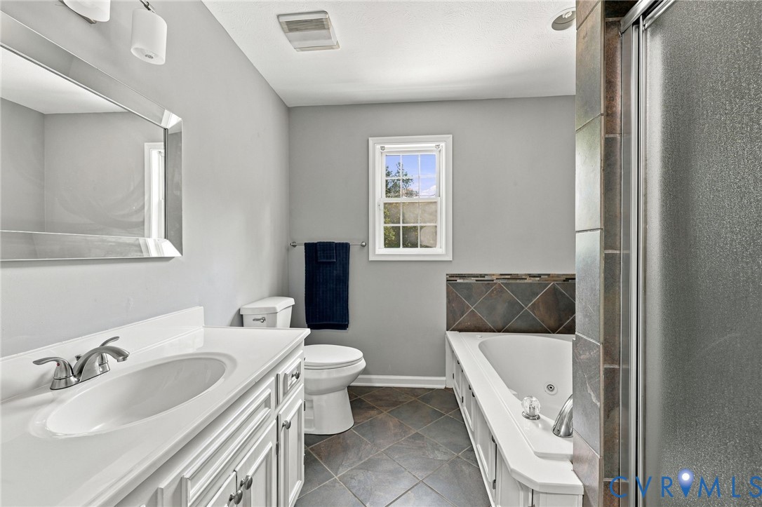 1626 Oak Ridge Road Appomattox, VA 24522 - Photo 25 of 30 White vanity with an integrated sink, brushed nick