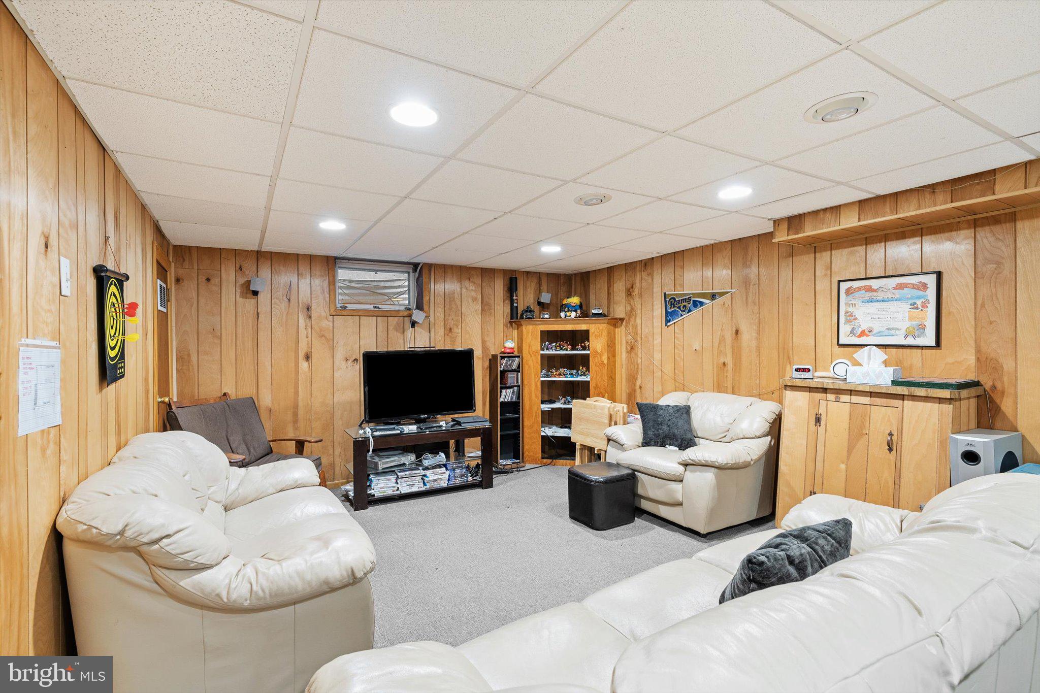 3 David Drive Ewing, NJ 08638 - Photo 21 of 32 a living room with furniture and a flat screen tv