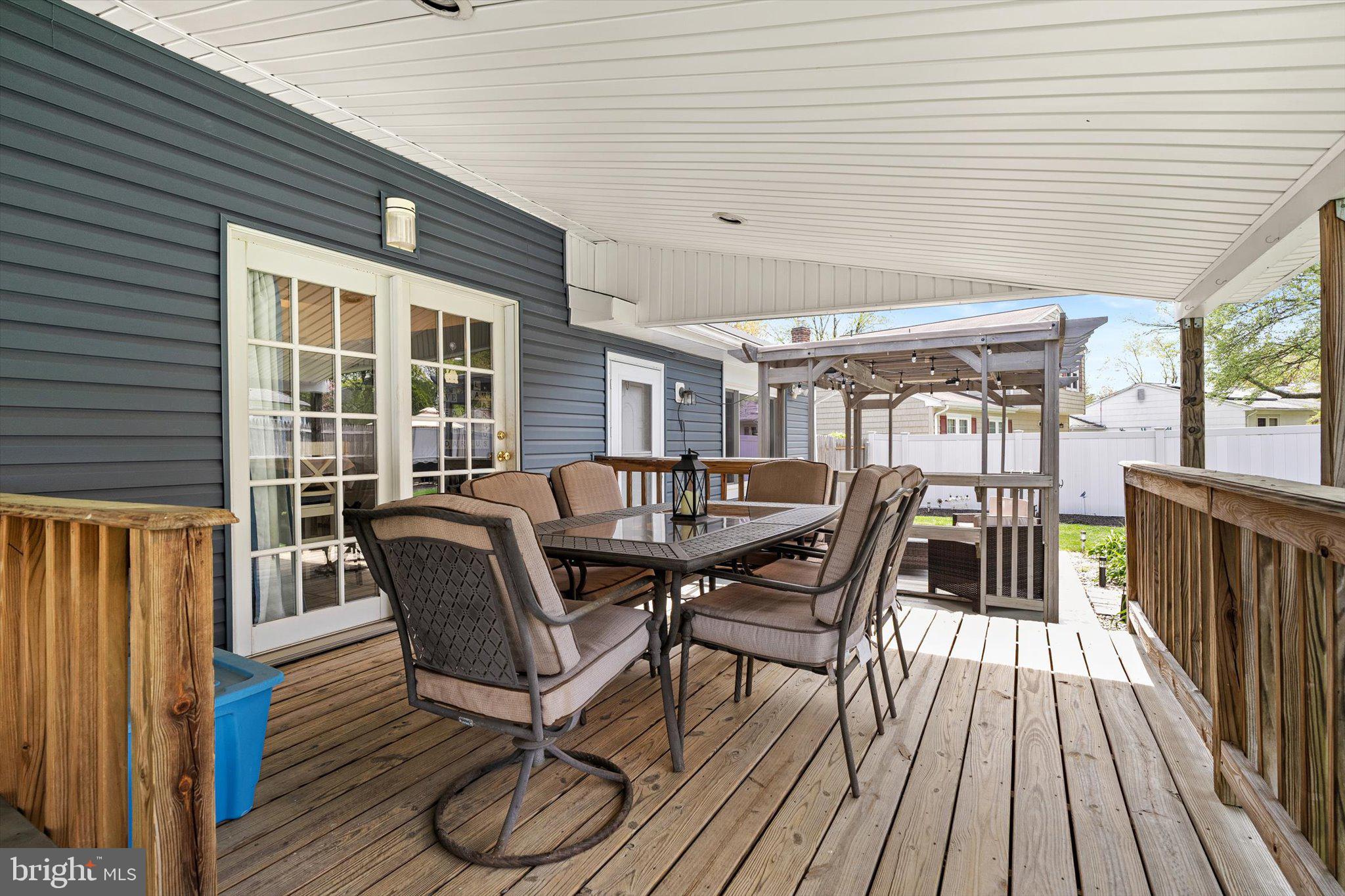 3 David Drive Ewing, NJ 08638 - Photo 25 of 32 a view of a patio with table and chairs and wooden floor