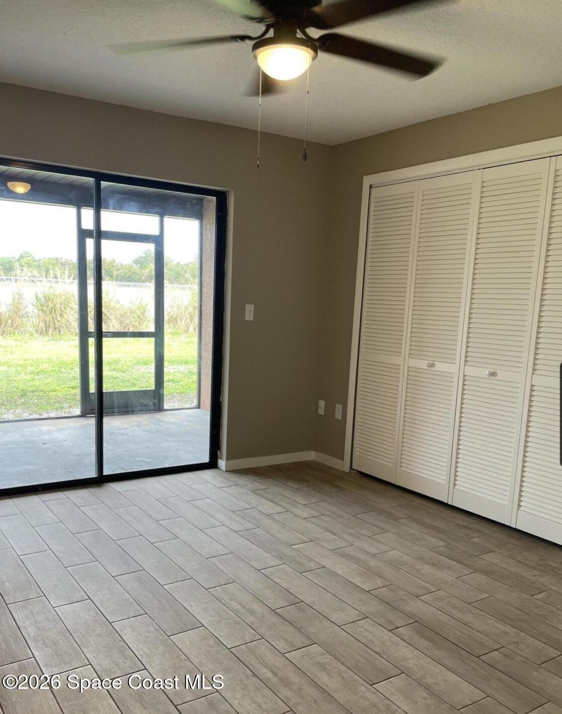 830 Angela Avenue, Unit B Rockledge, FL 32955 - Photo 6 of 9 a view of an empty room with a window