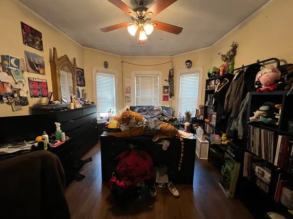 a living room with lots of furniture and a bed