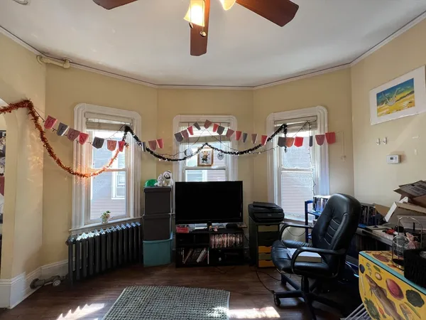 a living room with furniture workspace and a window