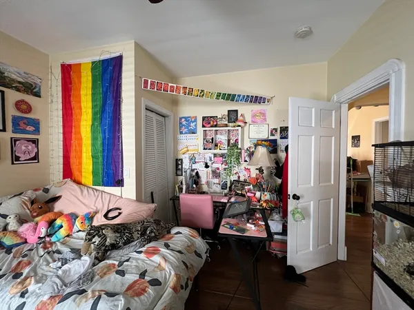 a bedroom with furniture and a window