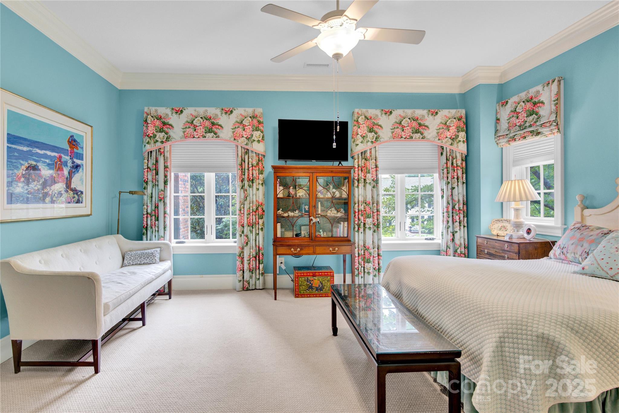 164 Cherokee Road Charlotte, NC 28207 - Photo 17 of 32 a living room with furniture a flat screen tv and a large window
