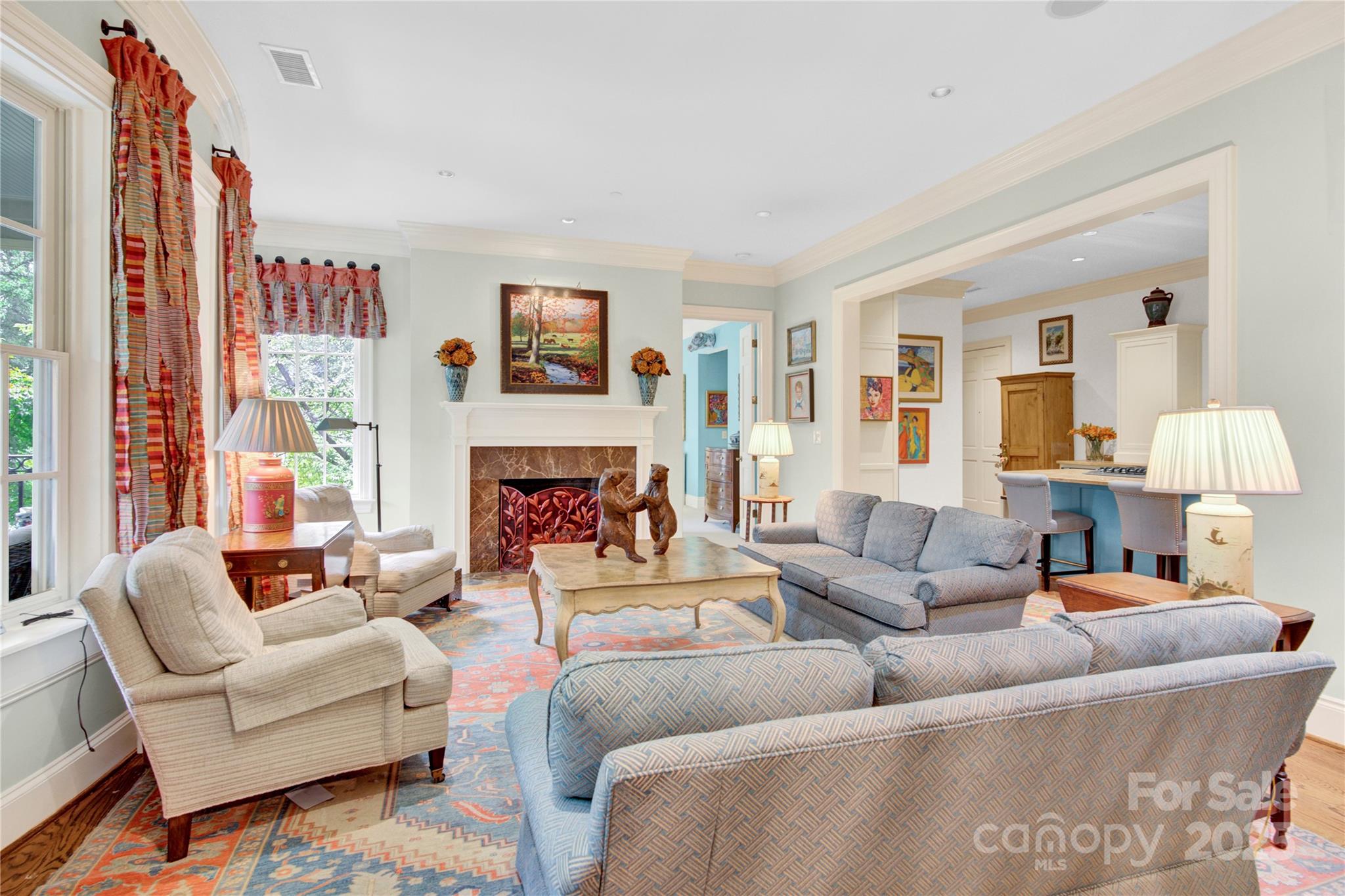 164 Cherokee Road Charlotte, NC 28207 - Photo 2 of 32 a living room with furniture fireplace and a large window