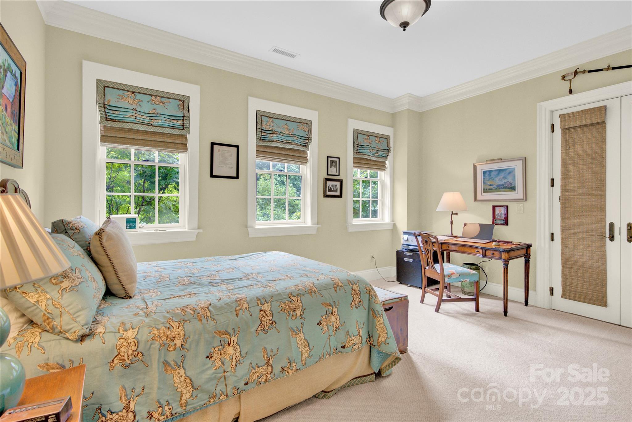 164 Cherokee Road Charlotte, NC 28207 - Photo 22 of 32 a bedroom with a bed and large windows