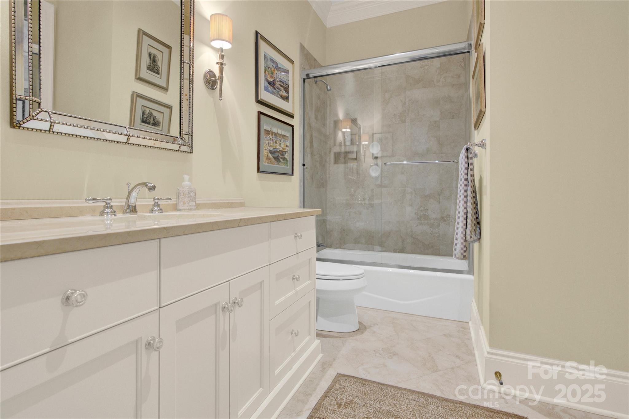 164 Cherokee Road Charlotte, NC 28207 - Photo 25 of 32 a bathroom with a sink a toilet and shower