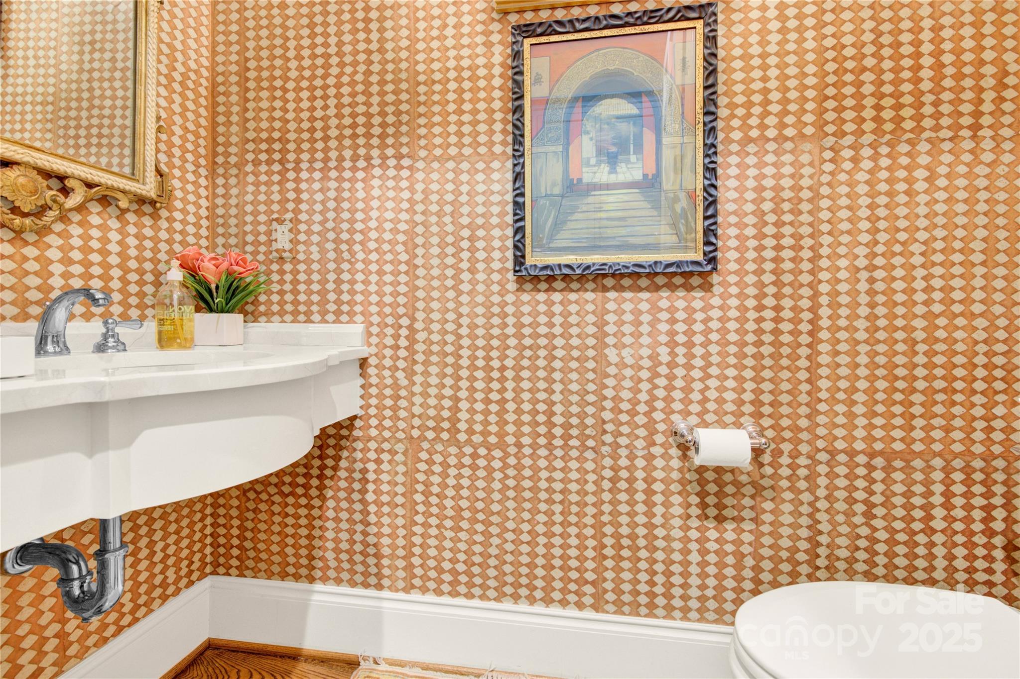 164 Cherokee Road Charlotte, NC 28207 - Photo 30 of 32 a bathroom with a toilet sink and mirror