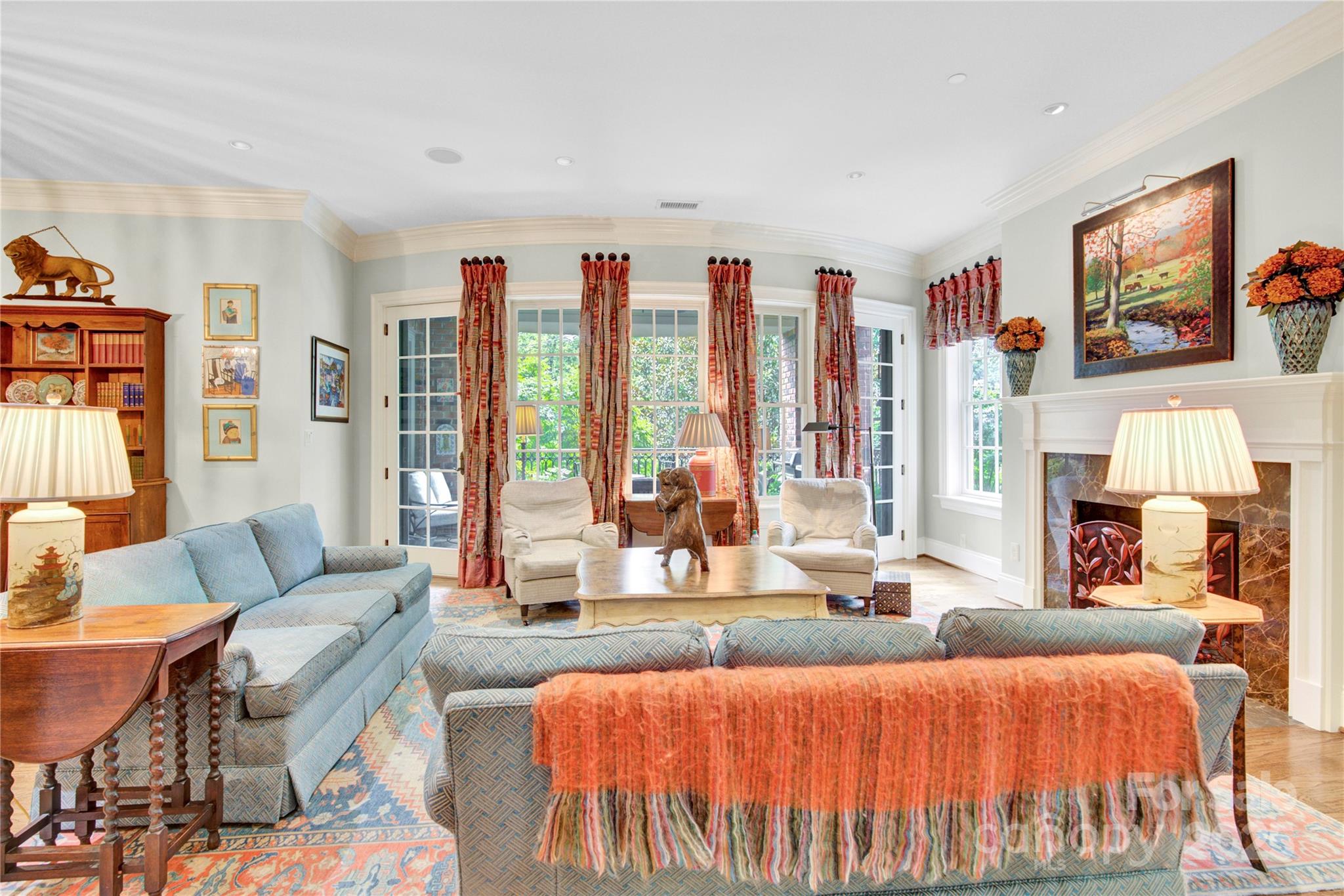 164 Cherokee Road Charlotte, NC 28207 - Photo 4 of 32 a living room with furniture a large window and a flat screen tv