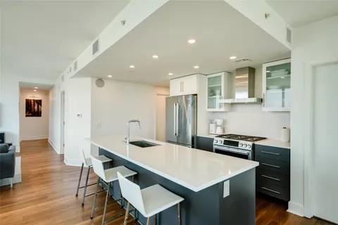 a kitchen that has a table and chairs in it