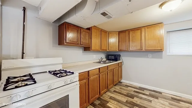 a kitchen with a stove and a sink