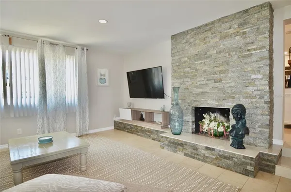 a bedroom with a bed and flat screen tv