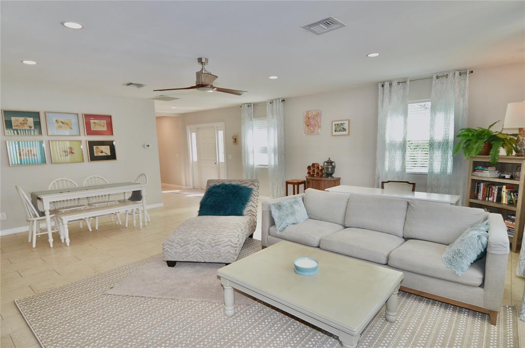 411 Pameto Road Nokomis, FL 34275 - Photo 19 of 85 a living room with furniture and a chandelier