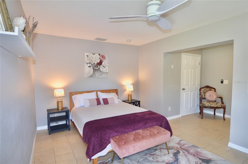 411 Pameto Road Nokomis, FL 34275 - Photo 24 of 85 a bedroom with a bed and furniture