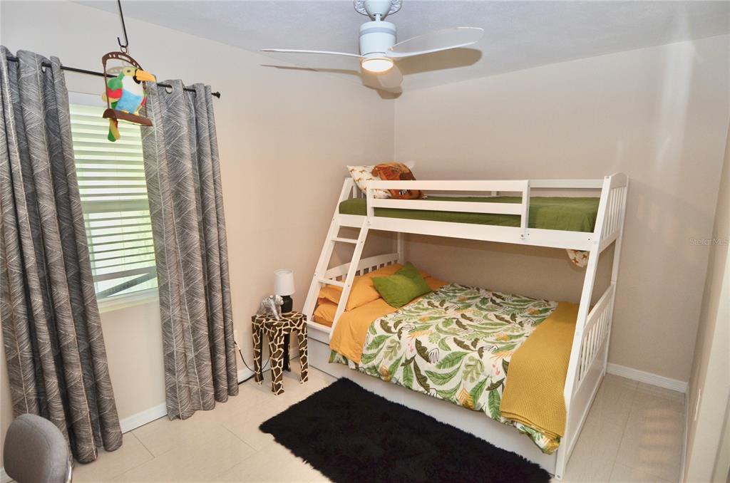411 Pameto Road Nokomis, FL 34275 - Photo 27 of 85 a bedroom with a bed and a window