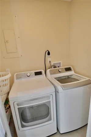 a kitchen with stainless steel appliances granite countertop a refrigerator stove and microwave