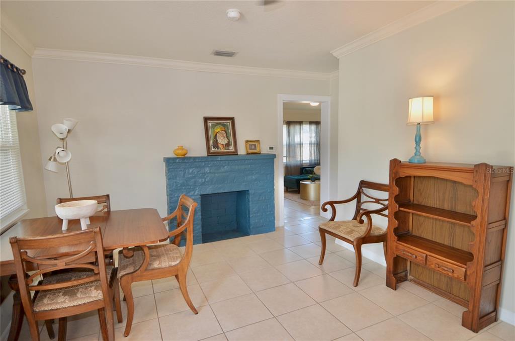 411 Pameto Road Nokomis, FL 34275 - Photo 41 of 85 a living room with furniture and a fireplace