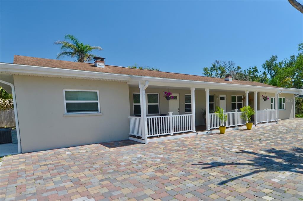 411 Pameto Road Nokomis, FL 34275 - Photo 56 of 85 a front view of a house with a yard