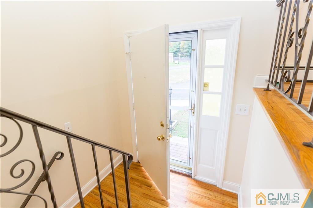 169 Old Post Road Edison, NJ 08817 - Photo 2 of 36 a view of an entryway with wooden floor