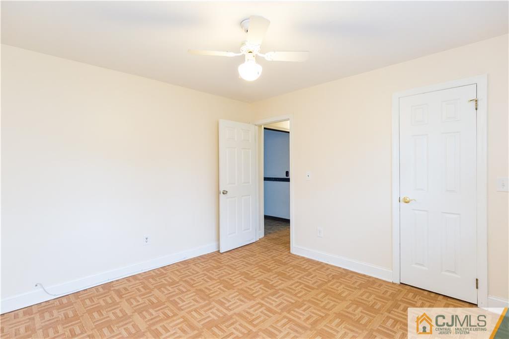 169 Old Post Road Edison, NJ 08817 - Photo 26 of 36 a view of a room with a ceiling fan and a window