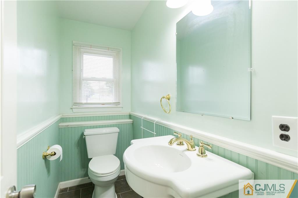 169 Old Post Road Edison, NJ 08817 - Photo 31 of 36 a bathroom with a sink a toilet and a mirror