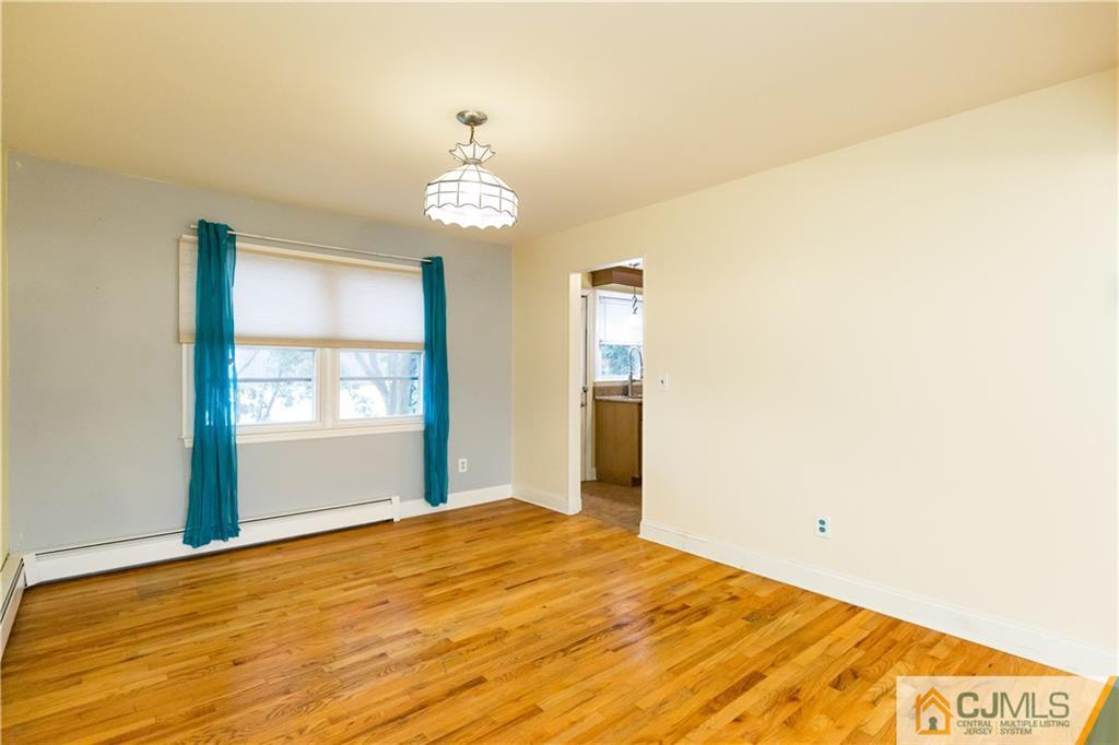 169 Old Post Road Edison, NJ 08817 - Photo 7 of 36 a bedroom with a bed and a window