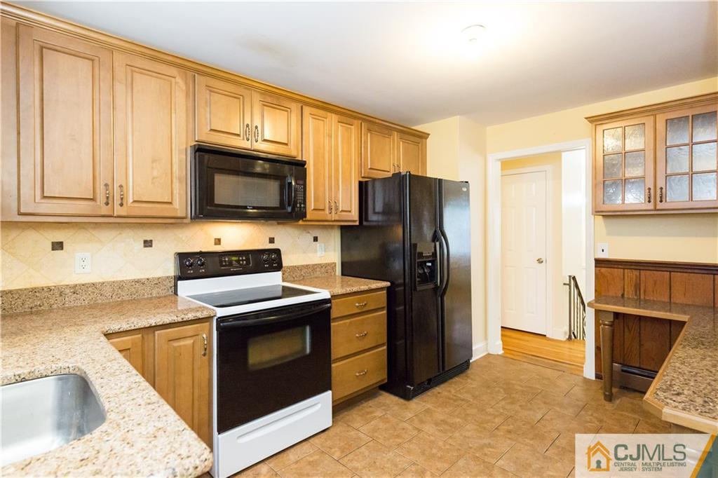 169 Old Post Road Edison, NJ 08817 - Photo 10 of 36 a kitchen with stainless steel appliances granite countertop a refrigerator stove top oven a sink and dishwasher