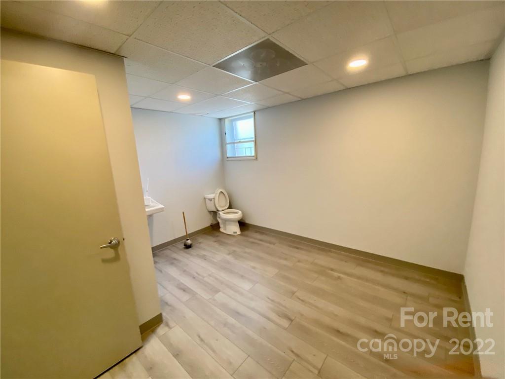 1119 2nd Street Northeast, Unit C Hickory, NC 28601 - Photo 3 of 16 a bathroom with a sink and a toilet