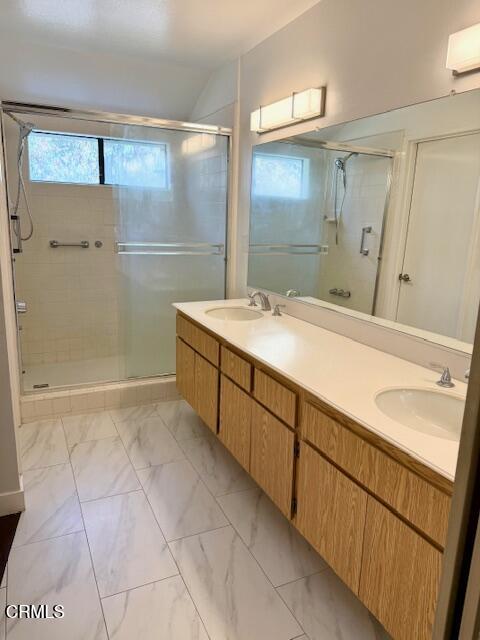 1213 Calle Lozano Camarillo, CA 93012 - Photo 16 of 29 a spacious bathroom with a granite countertop sink mirror and shower