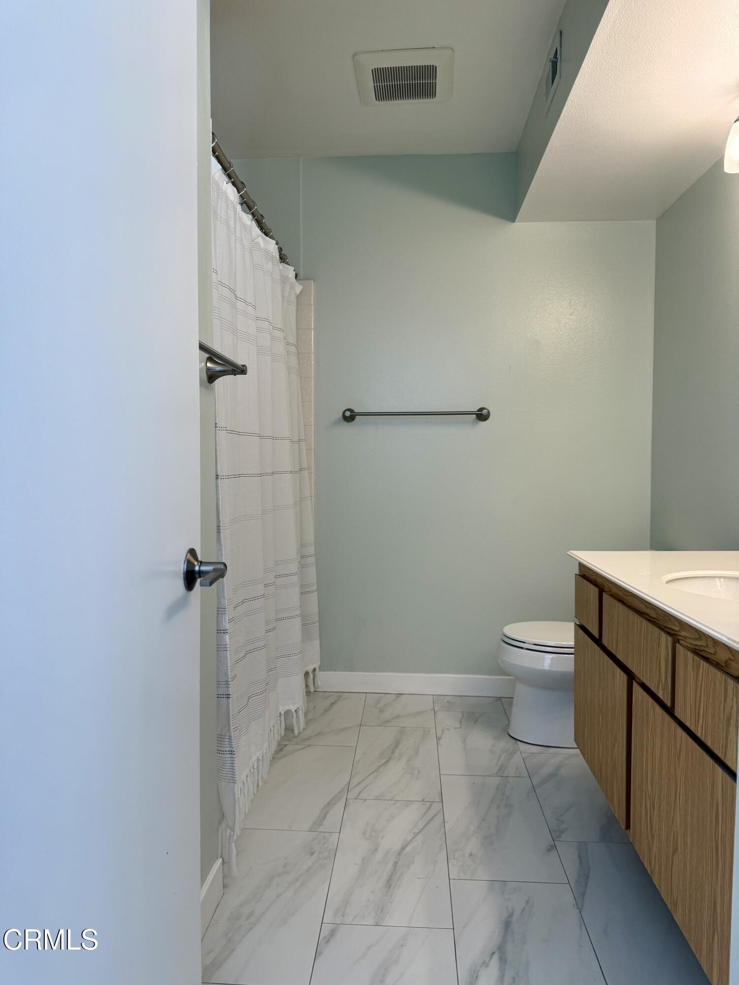 1213 Calle Lozano Camarillo, CA 93012 - Photo 18 of 29 a bathroom with a toilet and a shower