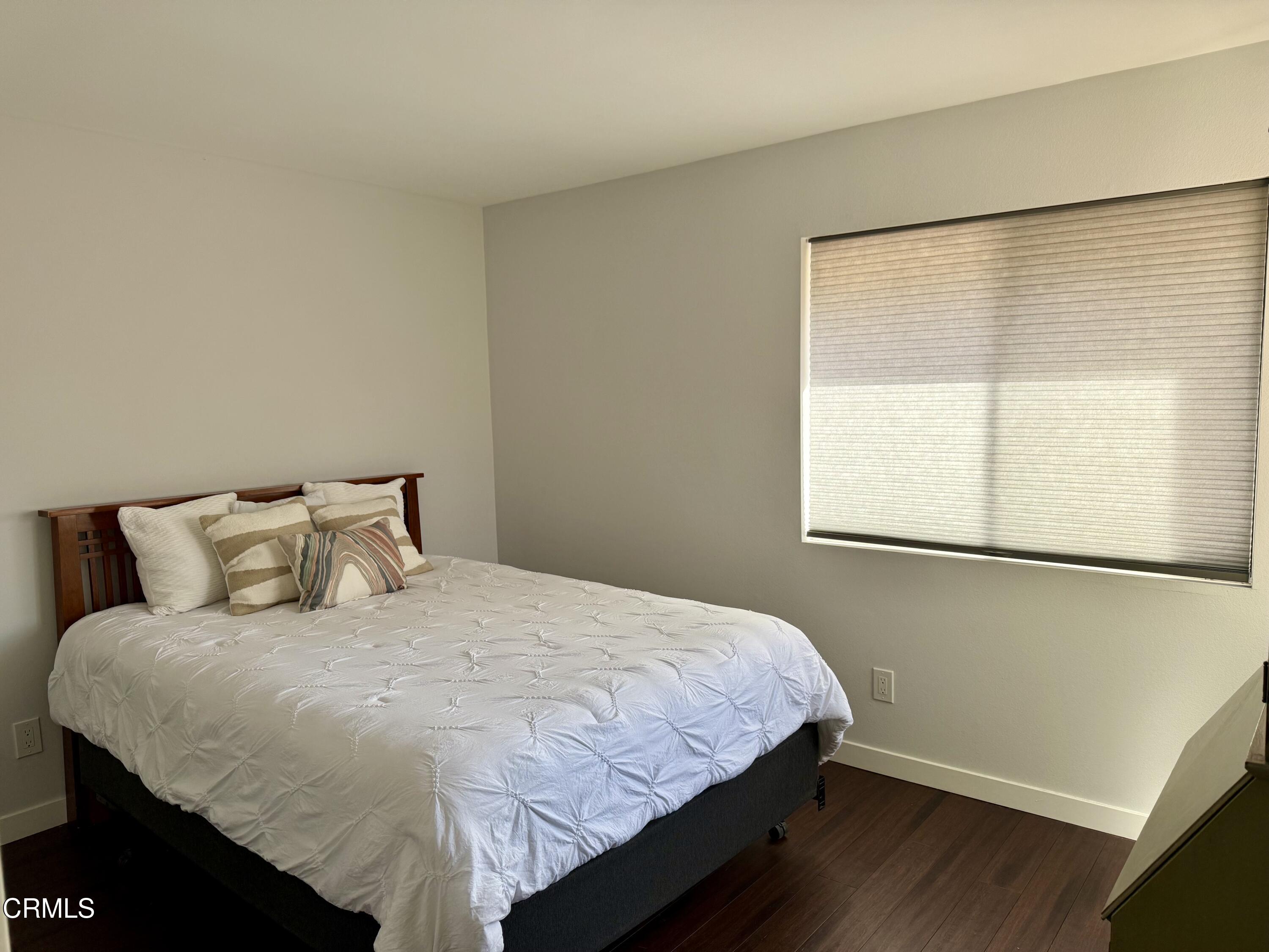 1213 Calle Lozano Camarillo, CA 93012 - Photo 19 of 29 a bedroom with a bed and a window