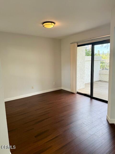 1213 Calle Lozano Camarillo, CA 93012 - Photo 6 of 29 a view of an empty room with wooden floor and a window