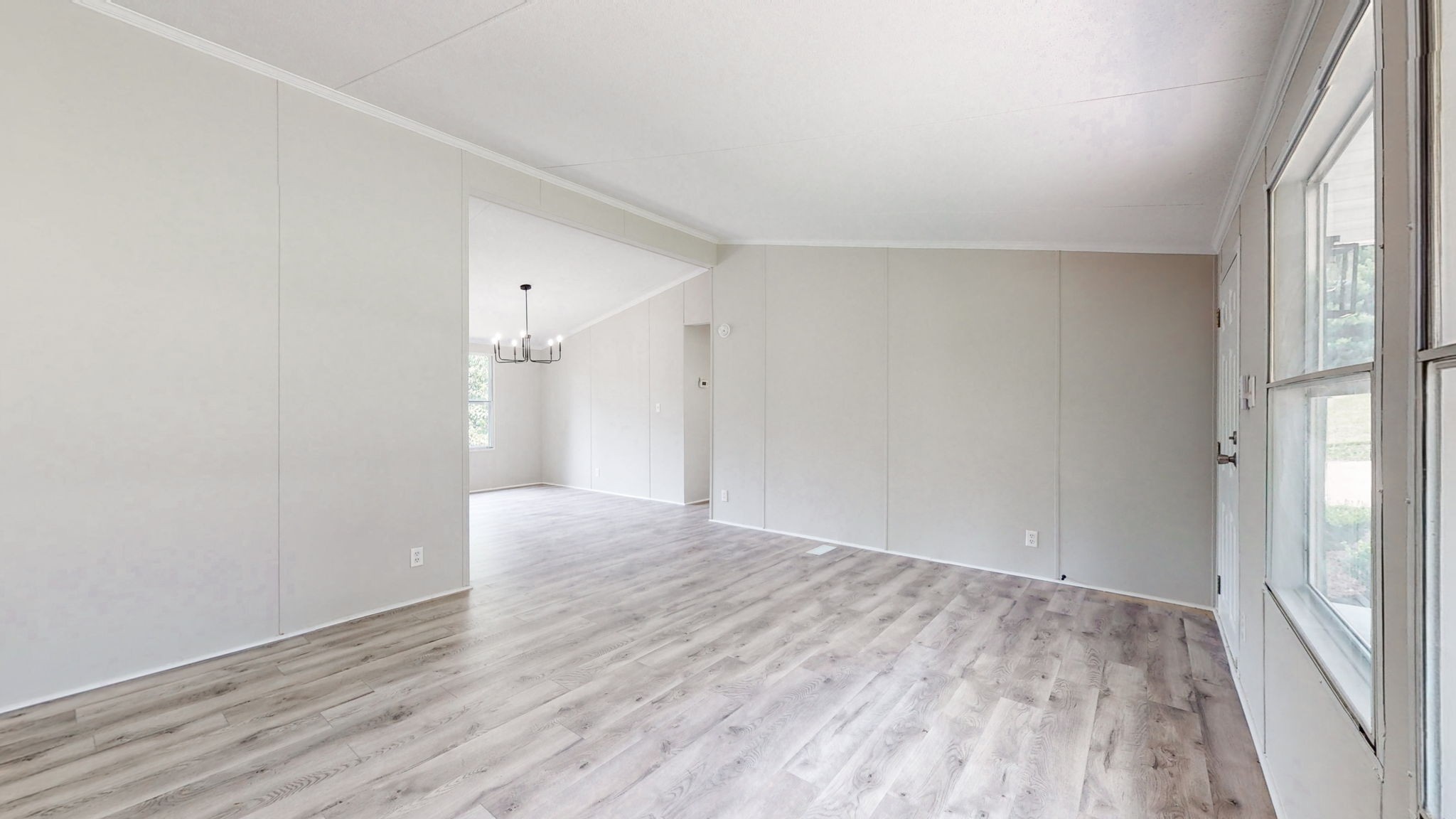 5023 Benders Ferry Road Mount Juliet, TN 37122 - Photo 14 of 62 a view of an empty room with wooden floor and a window