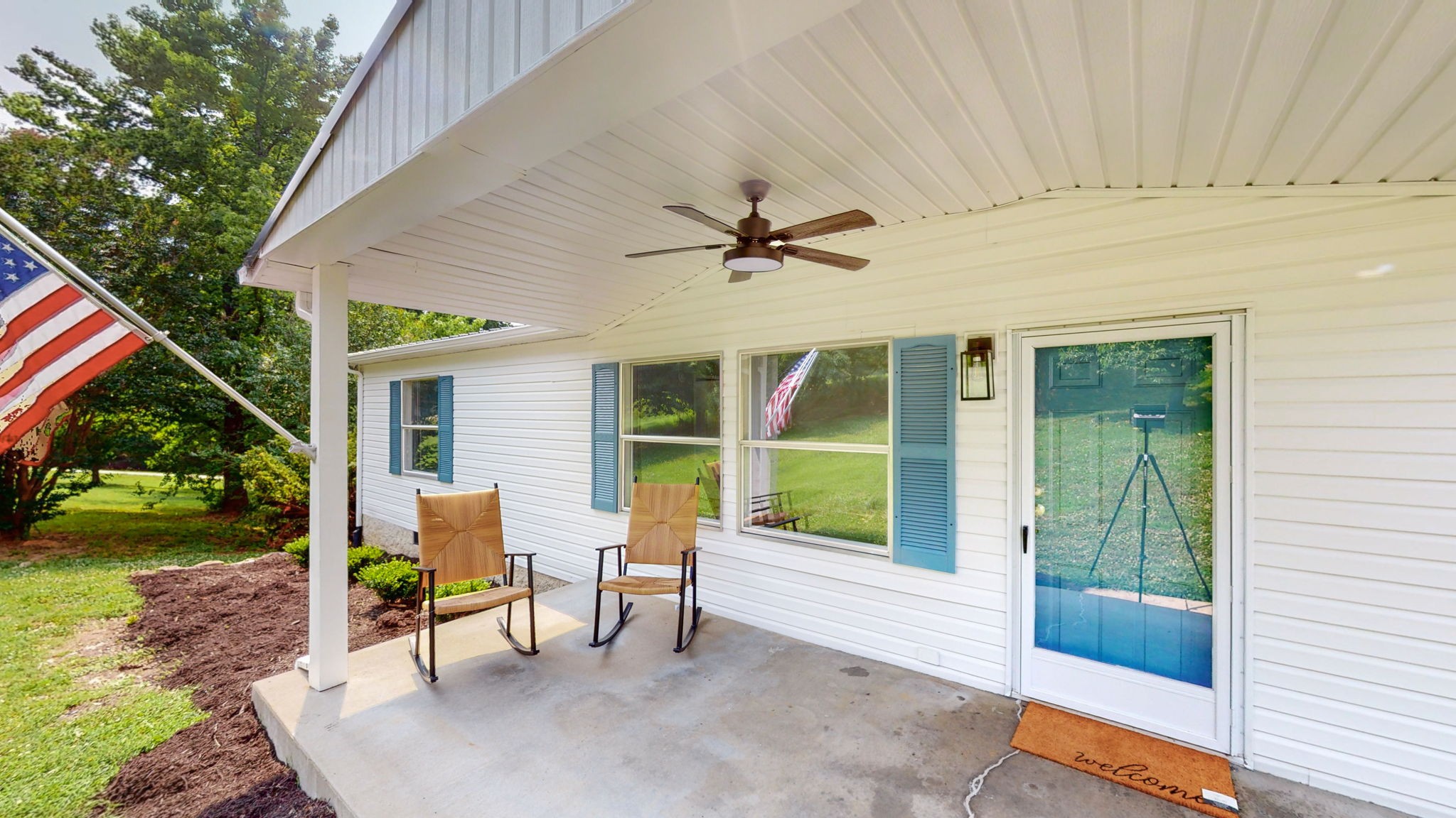 5023 Benders Ferry Road Mount Juliet, TN 37122 - Photo 2 of 62 a view of a patio with a table and chairs under an umbrella