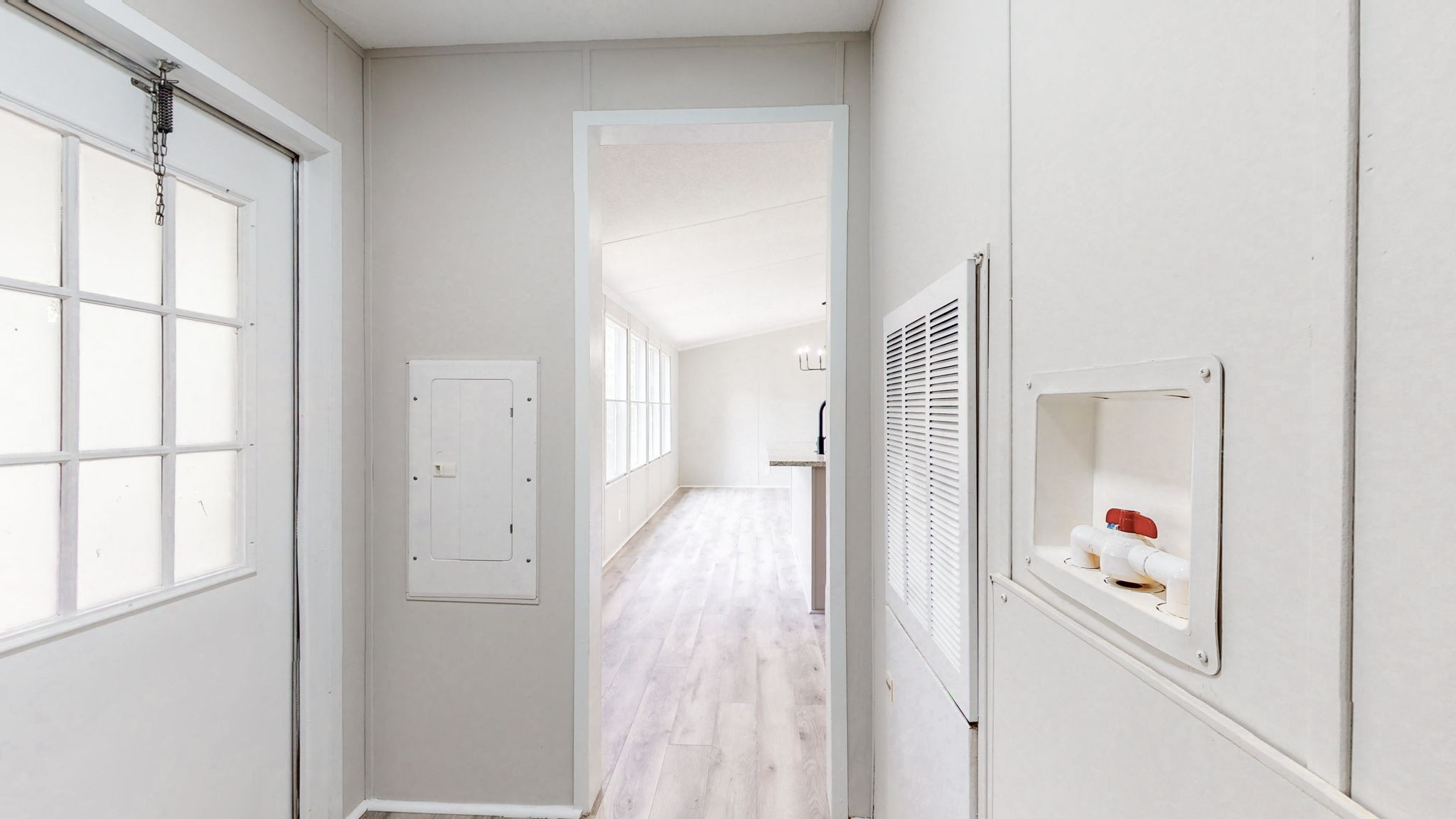 5023 Benders Ferry Road Mount Juliet, TN 37122 - Photo 23 of 62 a hallway with white doors wooden floor and next to a window
