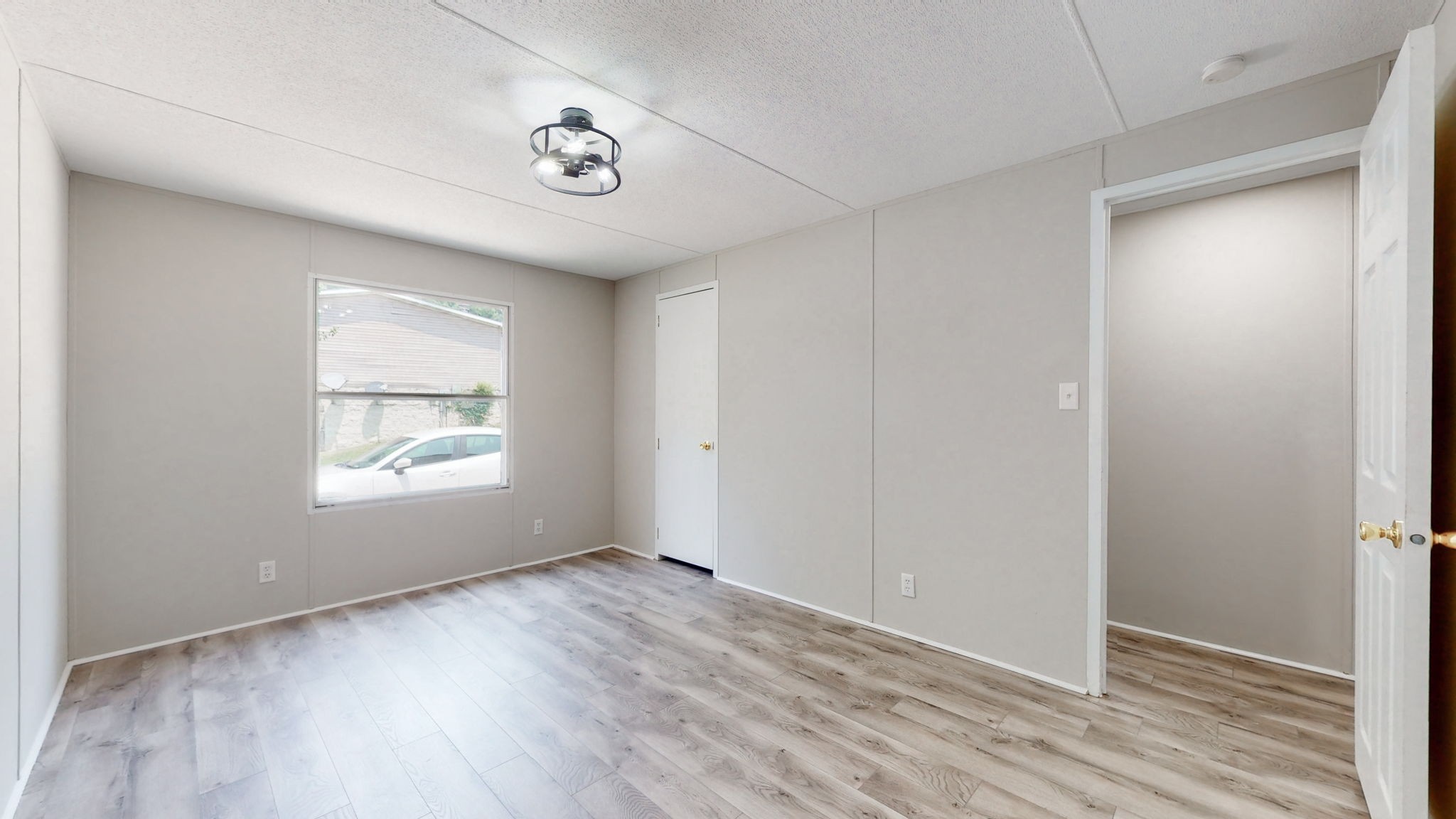 5023 Benders Ferry Road Mount Juliet, TN 37122 - Photo 30 of 62 a view of an empty room with wooden floor and a window