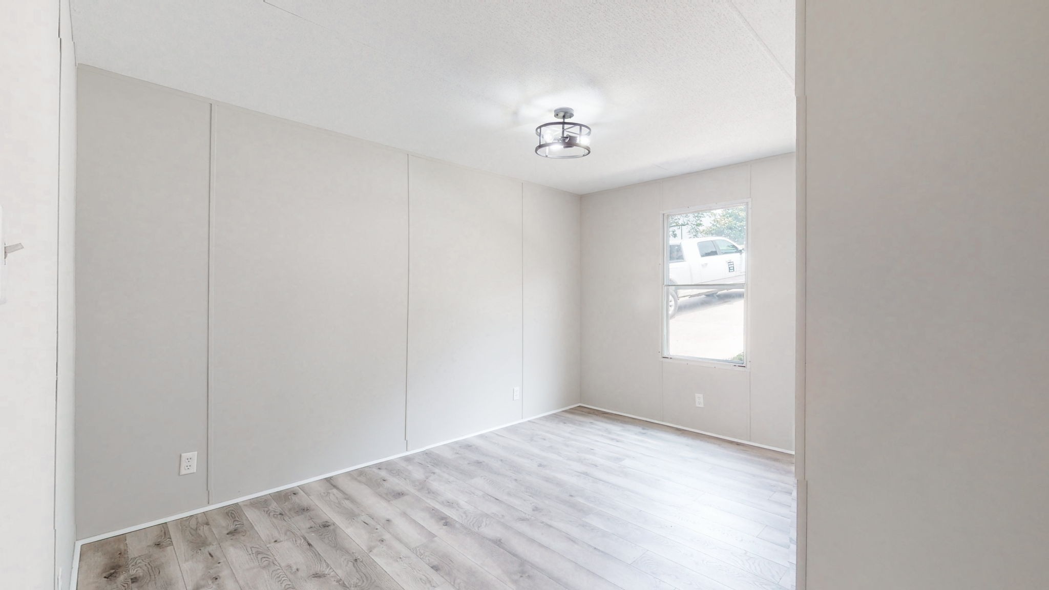 5023 Benders Ferry Road Mount Juliet, TN 37122 - Photo 32 of 62 an empty room with a chandelier fan and windows