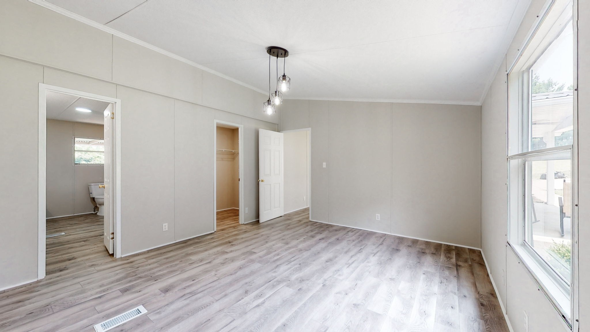 5023 Benders Ferry Road Mount Juliet, TN 37122 - Photo 36 of 62 an empty room with wooden floor and windows
