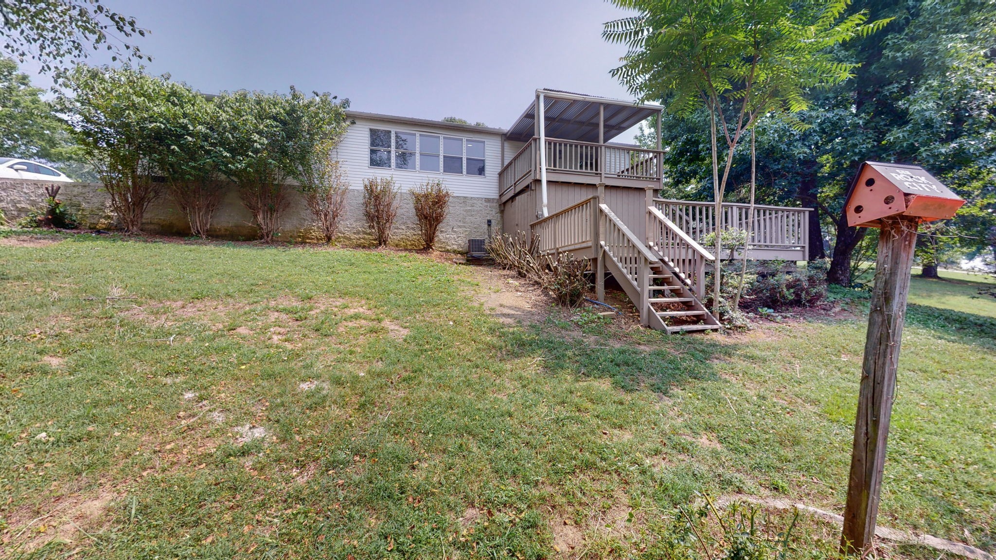 5023 Benders Ferry Road Mount Juliet, TN 37122 - Photo 49 of 62 a view of a house with a yard and sitting area