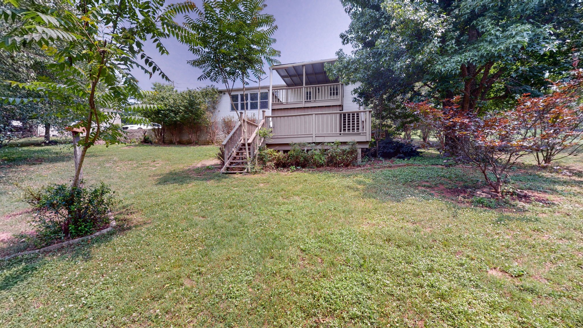 5023 Benders Ferry Road Mount Juliet, TN 37122 - Photo 51 of 62 a view of a house with a backyard