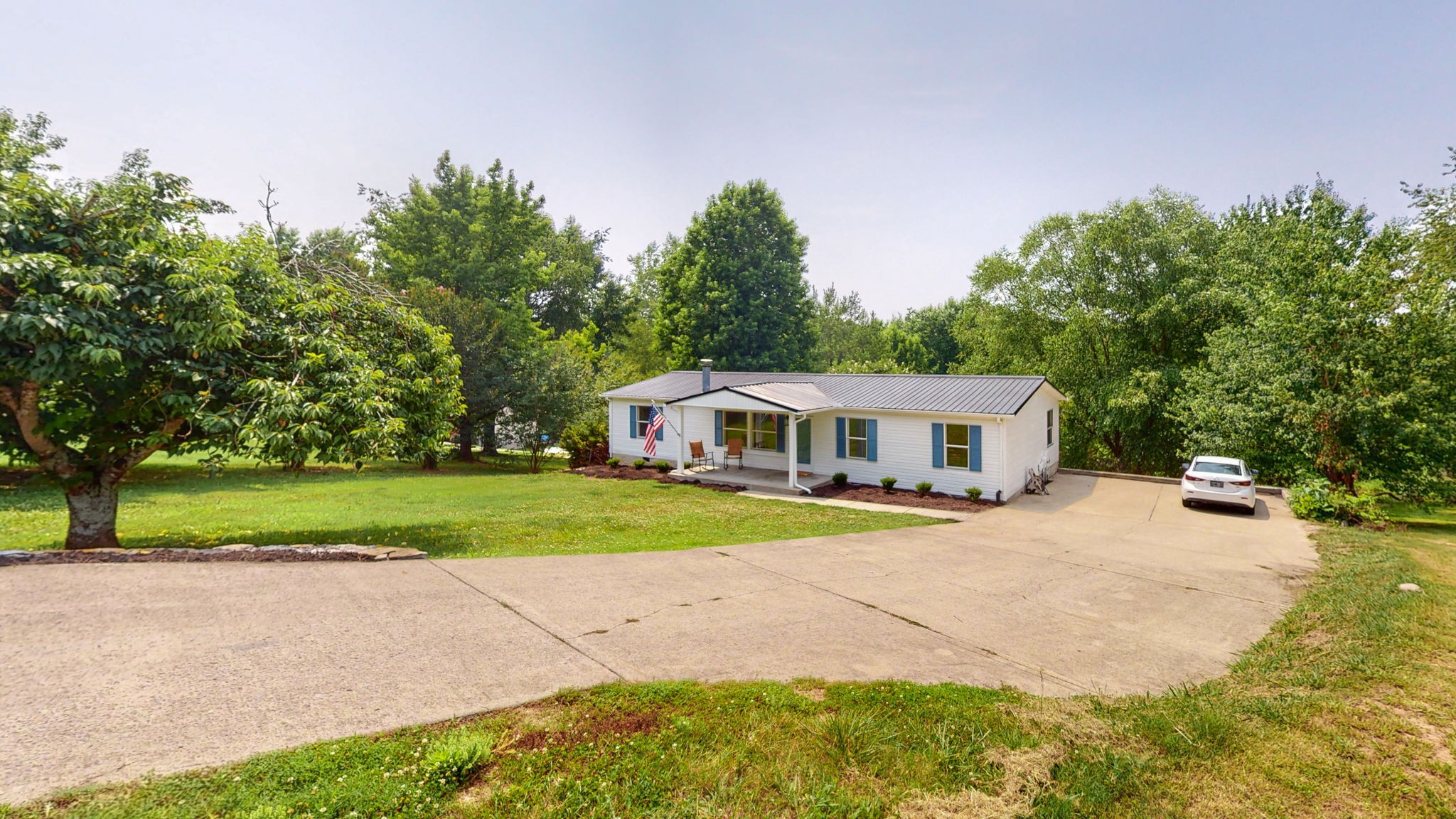 5023 Benders Ferry Road Mount Juliet, TN 37122 - Photo 60 of 62 a front view of a house with a yard and trees
