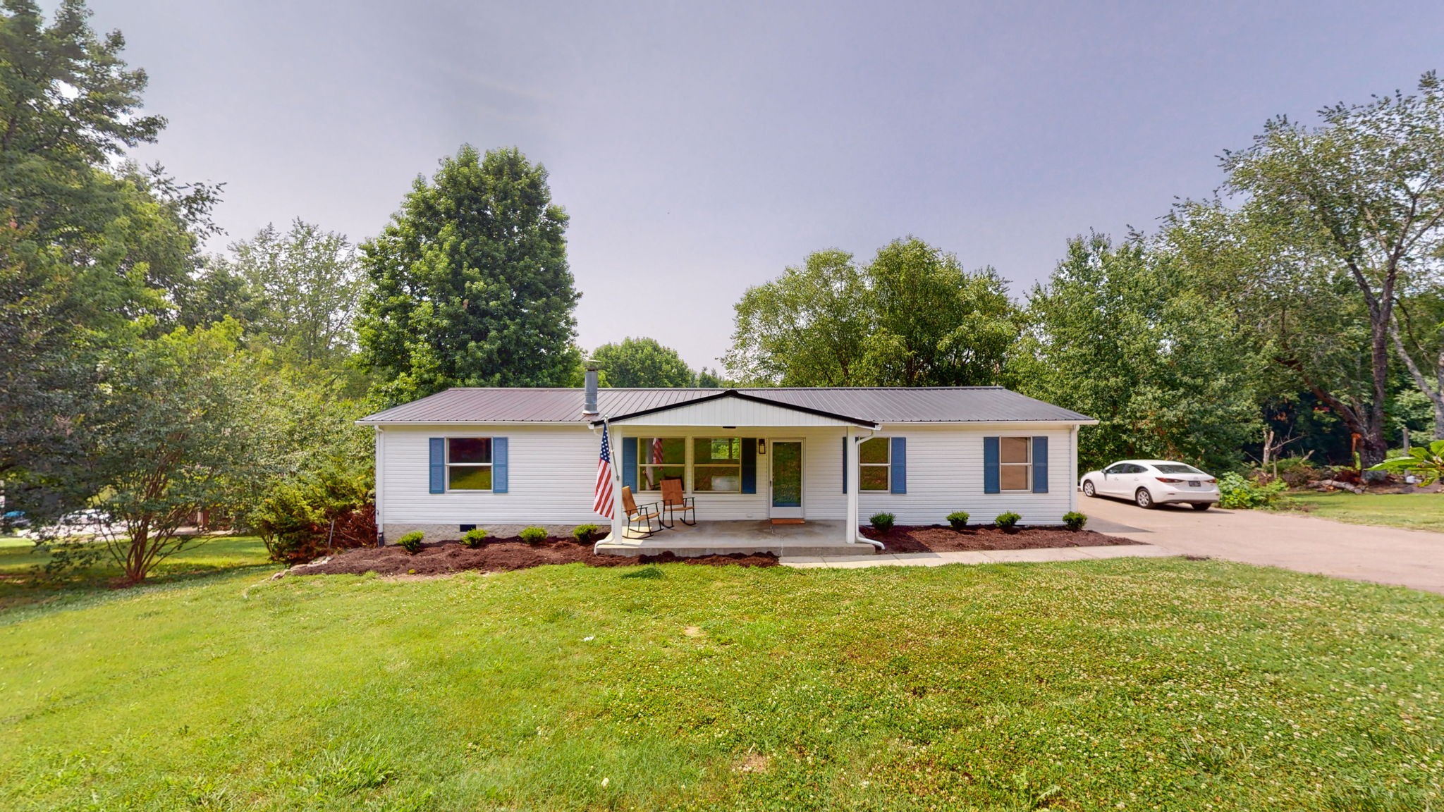 5023 Benders Ferry Road Mount Juliet, TN 37122 - Photo 61 of 62 a front view of a house with a garden and trees